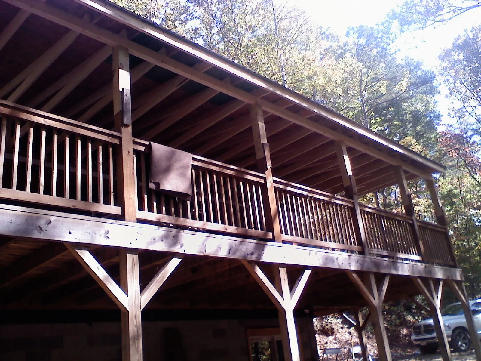 Timber framing under a new elevated porch and deck — Roof Leak Repair in Bokchito by Roofing Brothers